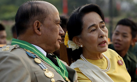 Aung San Suu Kyi sits among generals who have been criticized for the violence.